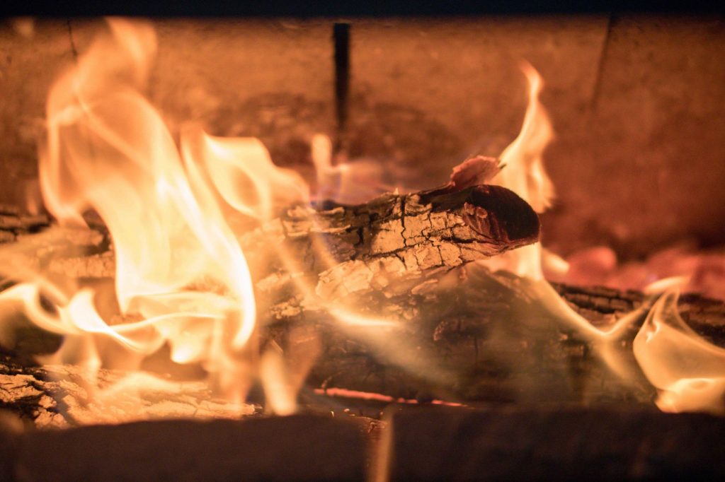 The glowing interior of a hot wood burning stove